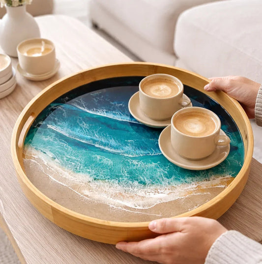 An ocean- inspired serving tray with 2 coffee cups 